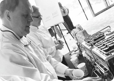 black & white filter barista serving coffee